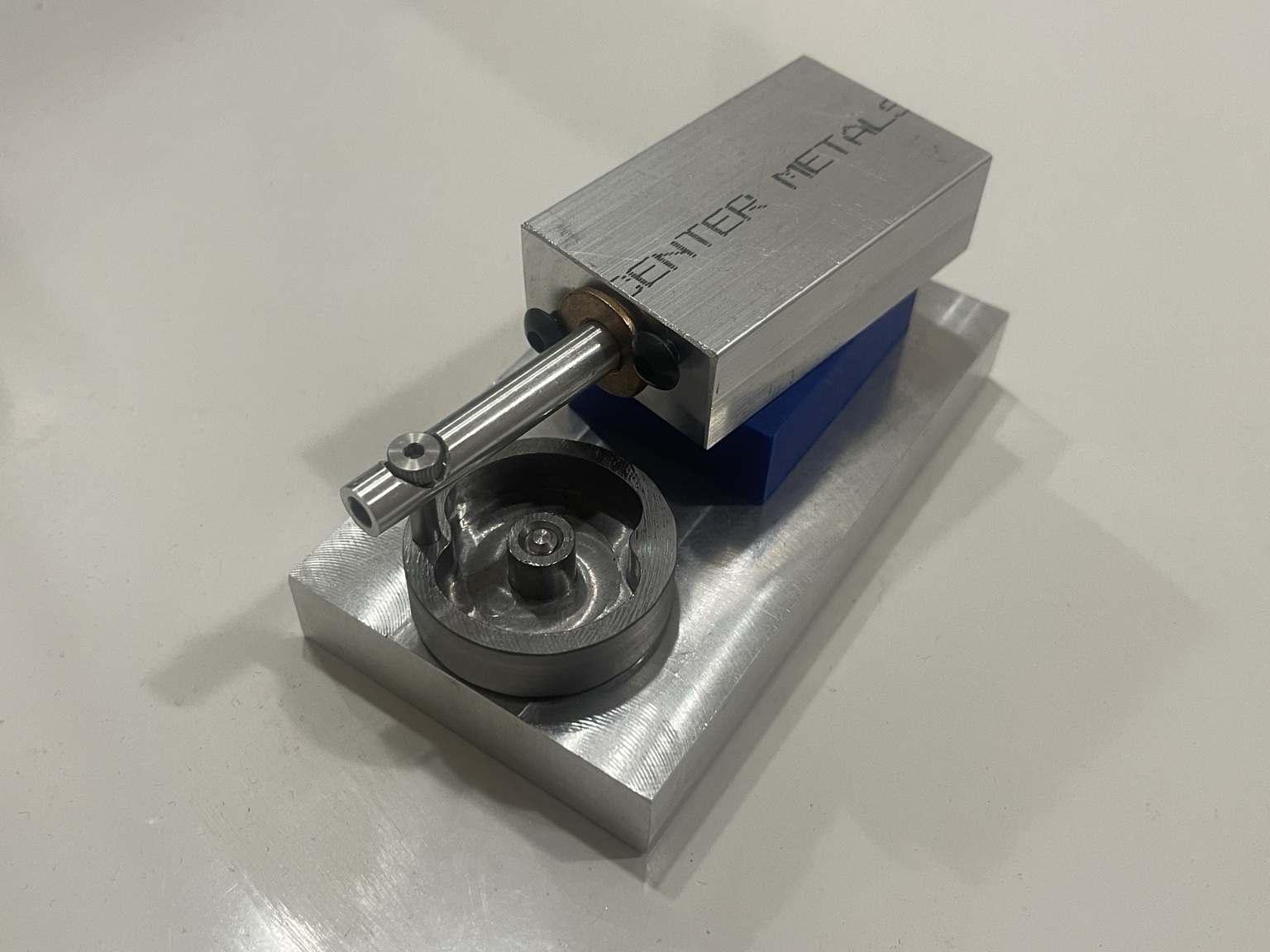Completed machined aluminum air engine mounted on a base